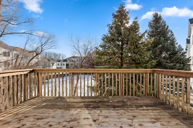 wooden terrace featuring a water view