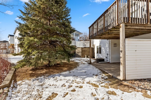 yard covered in snow with central AC unit