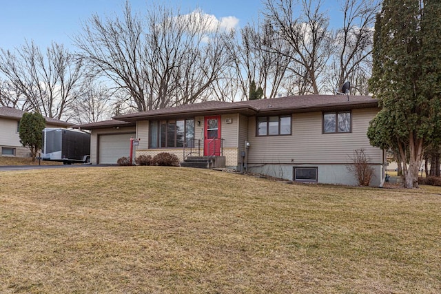 view of front facade with a front yard and a garage