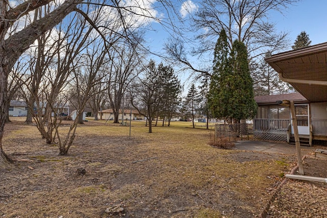 view of yard featuring a sunroom