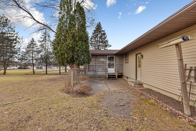 view of yard with a patio area and a sunroom