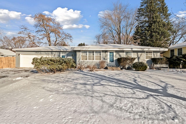 ranch-style house featuring a garage