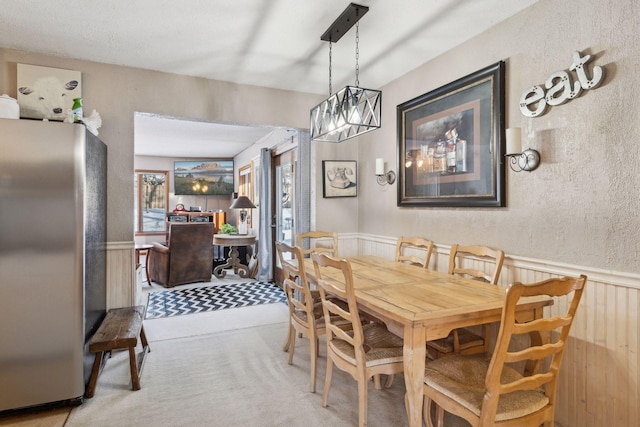 dining space featuring an inviting chandelier