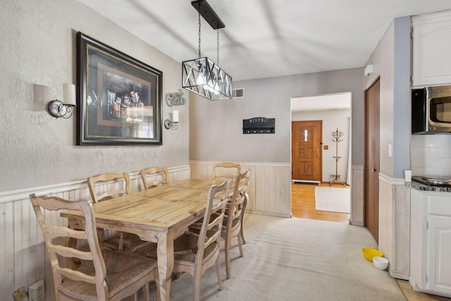 dining room featuring a chandelier