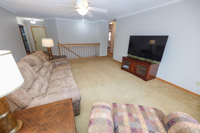 carpeted living room with crown molding and ceiling fan