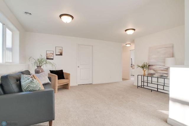 living room with light colored carpet