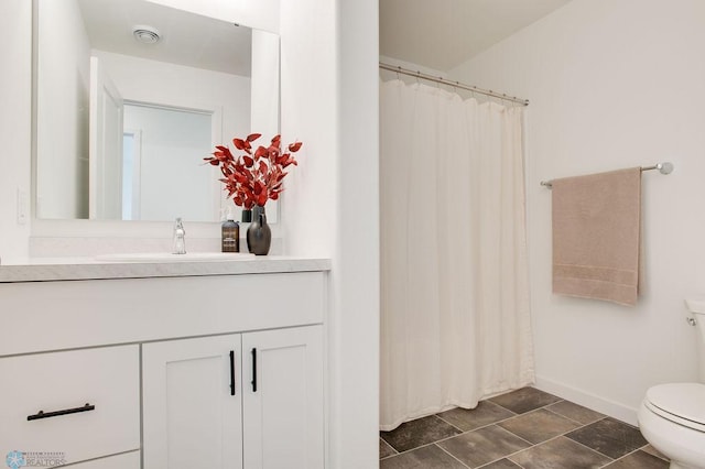 bathroom with vanity and toilet