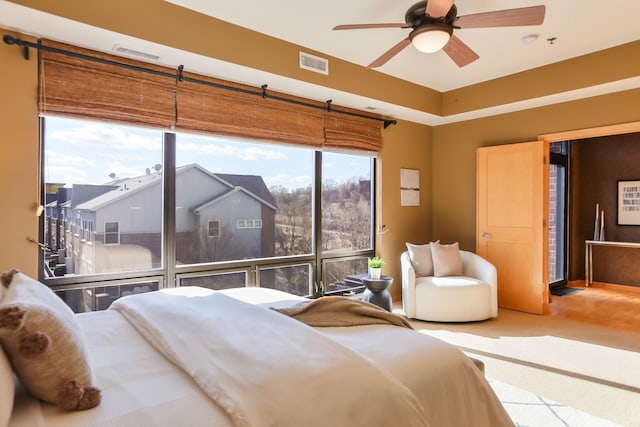 bedroom with visible vents and ceiling fan