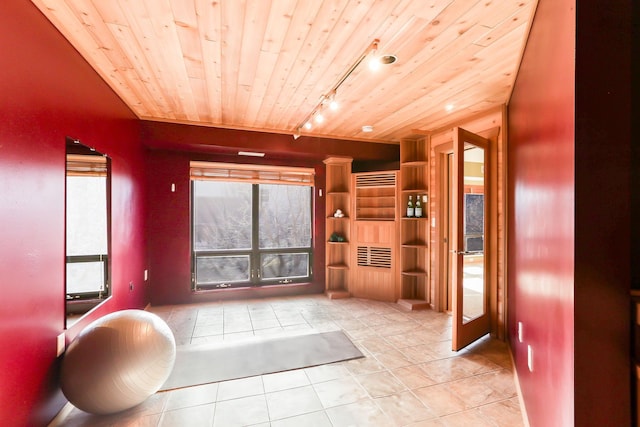 interior space featuring wooden ceiling, tile patterned flooring, and track lighting