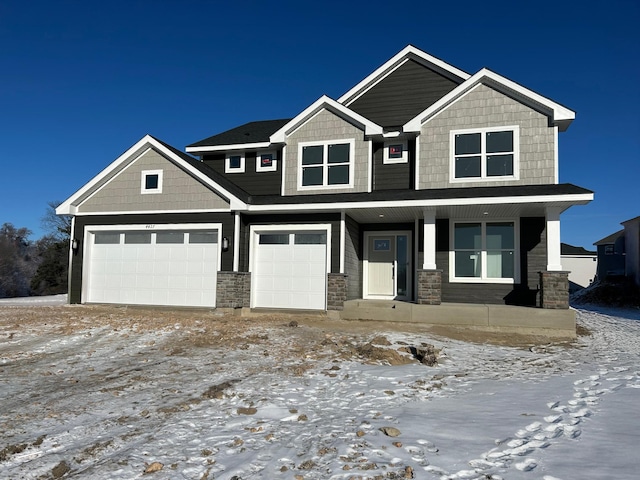 craftsman-style home featuring a porch and a garage