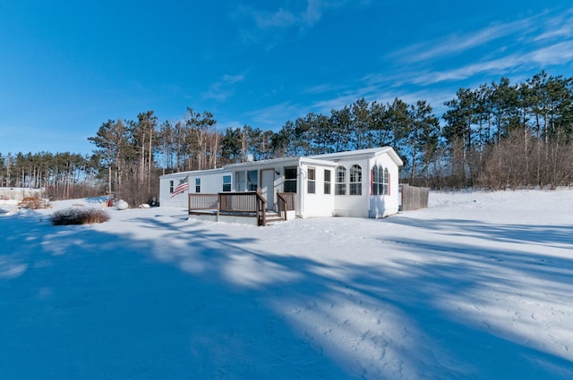 view of snow covered house