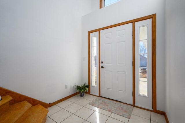 tiled foyer entrance with a wealth of natural light