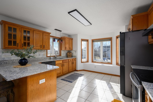 kitchen featuring pendant lighting, sink, light tile patterned flooring, decorative backsplash, and kitchen peninsula