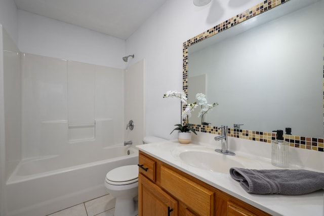 full bathroom featuring tile patterned floors, toilet, shower / tub combination, vanity, and decorative backsplash