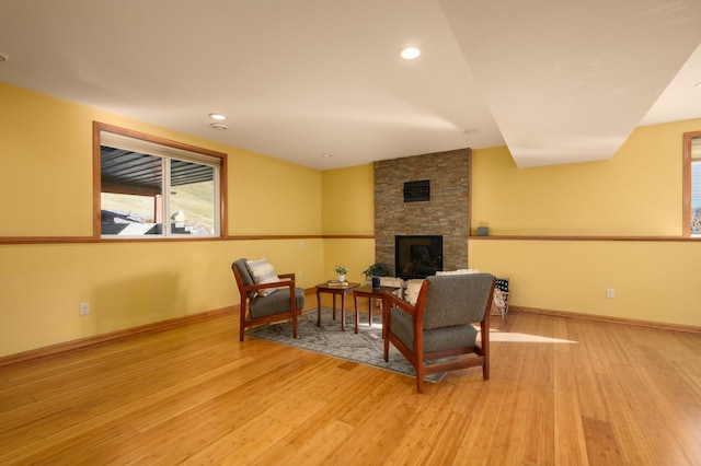 sitting room featuring a fireplace and light hardwood / wood-style floors