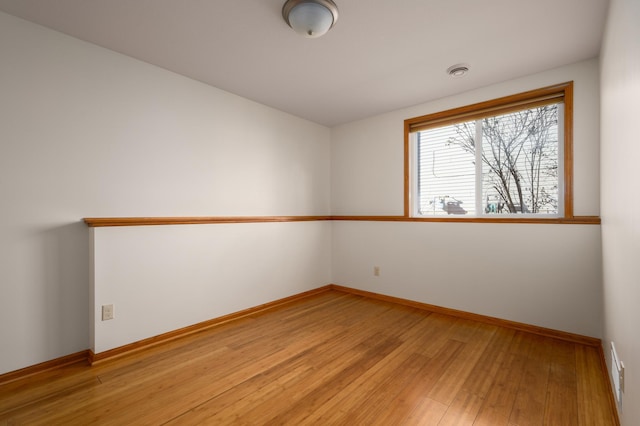 unfurnished room featuring light wood-type flooring