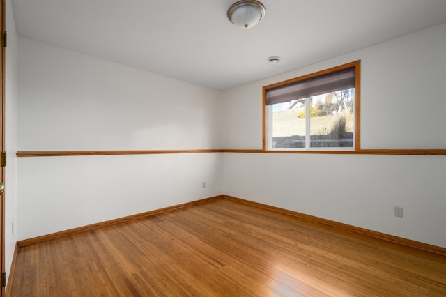 spare room with light wood-type flooring