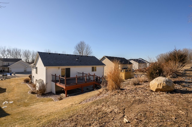 back of property with a wooden deck