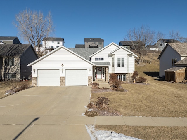 view of front of house featuring a garage and a front yard