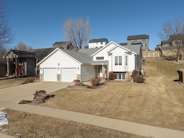 view of front facade featuring a garage and a front lawn