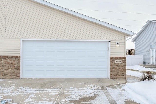 view of snow covered garage