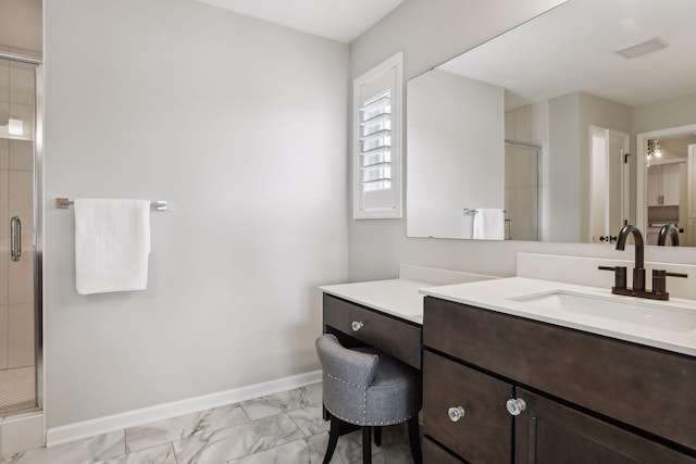 full bath featuring marble finish floor, a stall shower, vanity, and baseboards