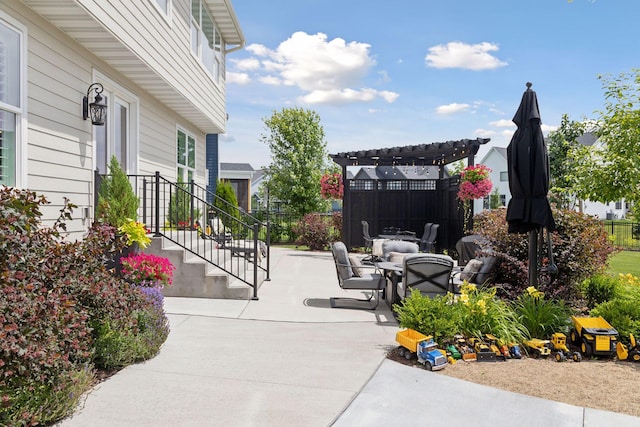 view of community with fence, a pergola, and a patio