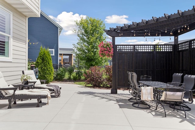 view of patio / terrace featuring outdoor dining area, fence, and a pergola