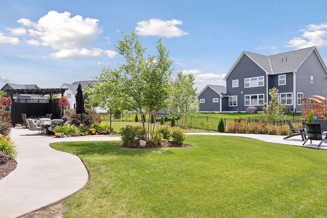 surrounding community with a yard, a patio area, and fence