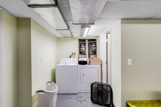 clothes washing area with washing machine and clothes dryer