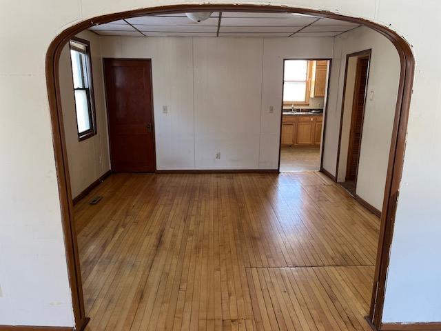 spare room with light hardwood / wood-style flooring and sink