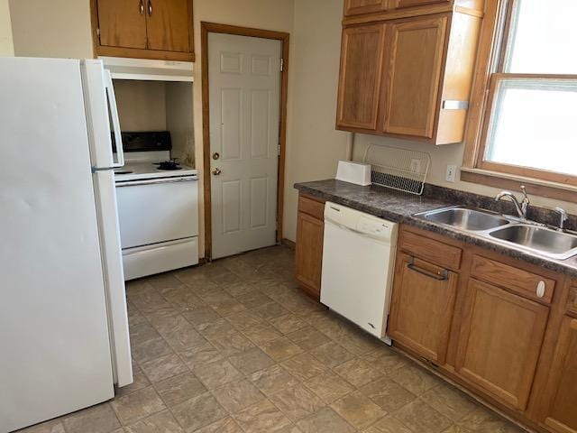 kitchen with white appliances and sink