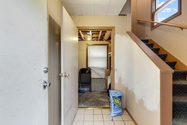 stairway featuring tile patterned floors