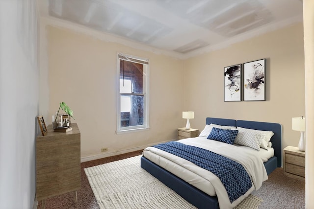 bedroom with carpet floors and baseboards