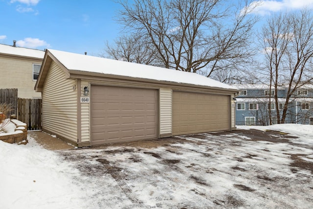 view of snow covered garage