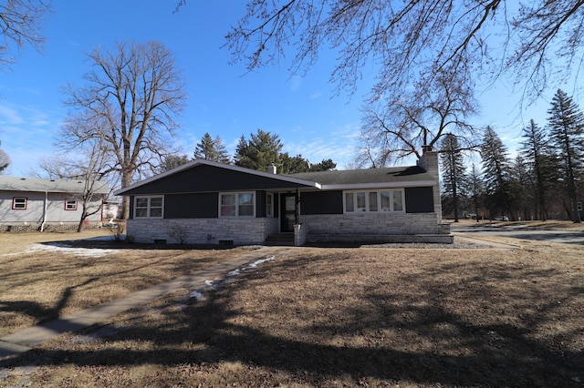 view of front of property with stone siding, a chimney, and crawl space