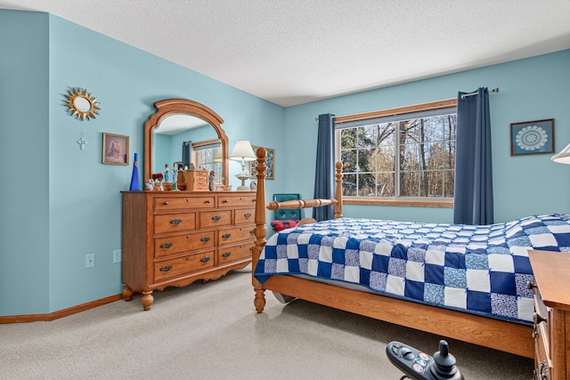 bedroom with a textured ceiling and carpet flooring