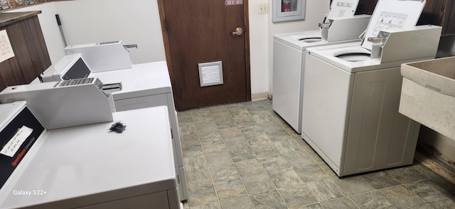 laundry room with independent washer and dryer