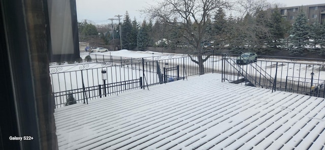 view of snow covered deck