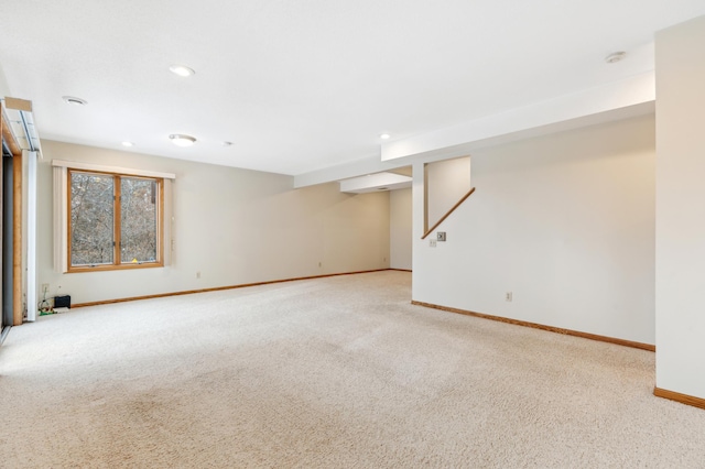 unfurnished room featuring light carpet