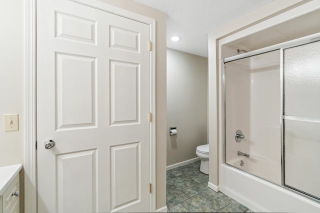 bathroom with shower / bath combination with glass door, tile patterned floors, a textured ceiling, and toilet