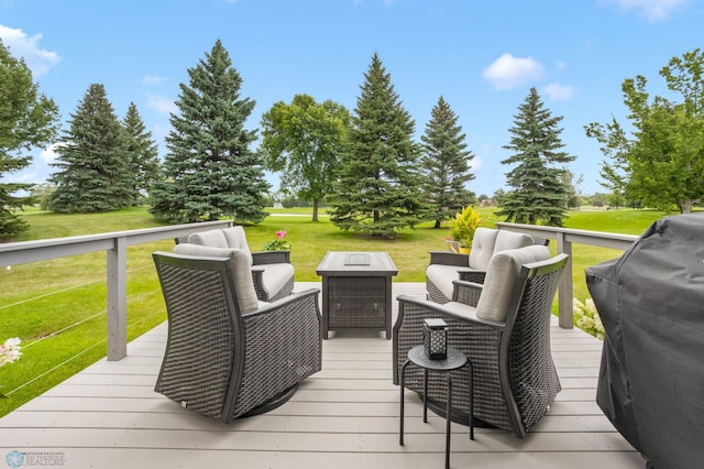 deck featuring an outdoor hangout area, a yard, and area for grilling