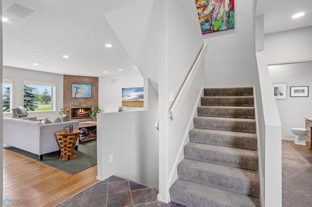 staircase with a fireplace