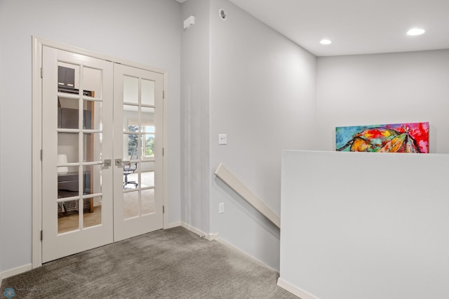 doorway with french doors and carpet