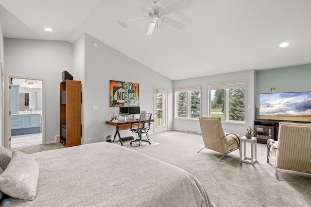 carpeted bedroom featuring ceiling fan, ensuite bathroom, high vaulted ceiling, and sink