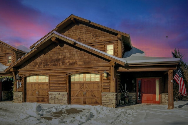 log home featuring a garage