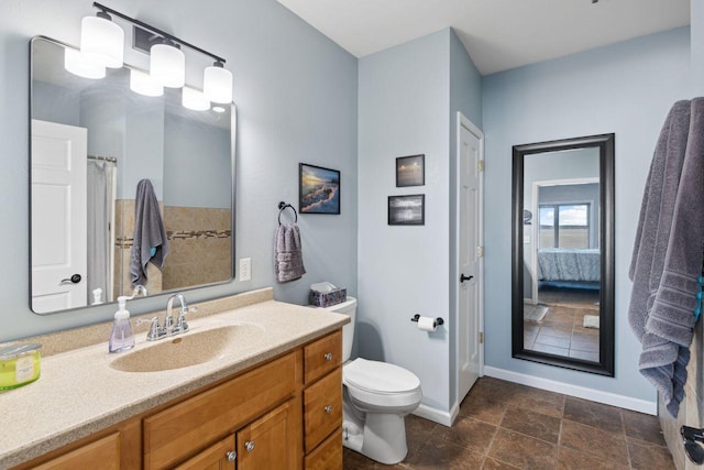 bathroom featuring vanity and toilet