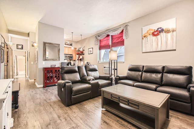 living room with light hardwood / wood-style flooring