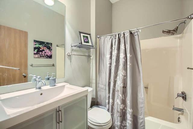 full bathroom with toilet, vanity, and shower / tub combo with curtain