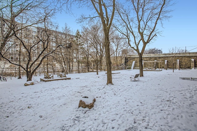 view of yard layered in snow